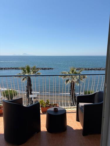a balcony with a view of the ocean at L'Abbraccio di Parthenope in Torre del Greco