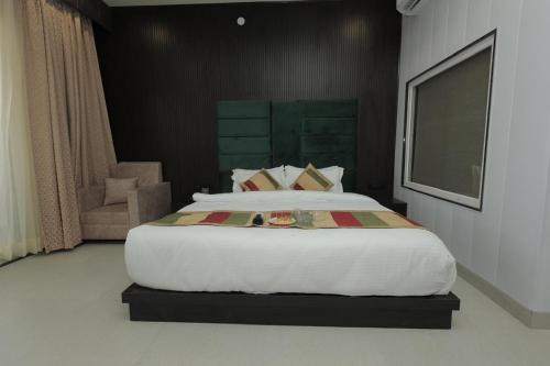 THE TRADE INTERNATIONAL HOTEL Jaipurにあるベッド