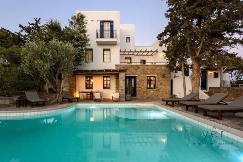 a swimming pool in front of a house at 6BR Villa with Private Pool, 4 Baths & Garden -PADMA in Angairiá