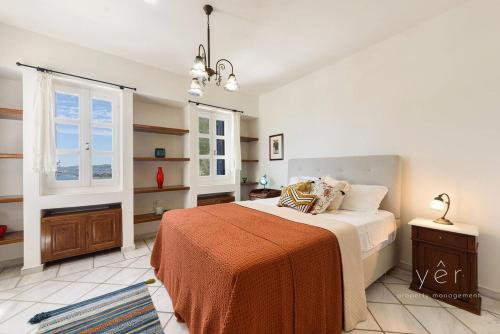 a bedroom with a bed and a window at 6BR Villa with Private Pool, 4 Baths & Garden -PADMA in Angairiá