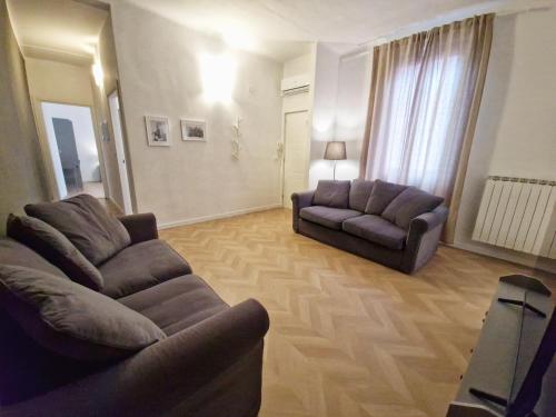 a living room with two chairs and a couch at La Ca' di sogn in Pavia