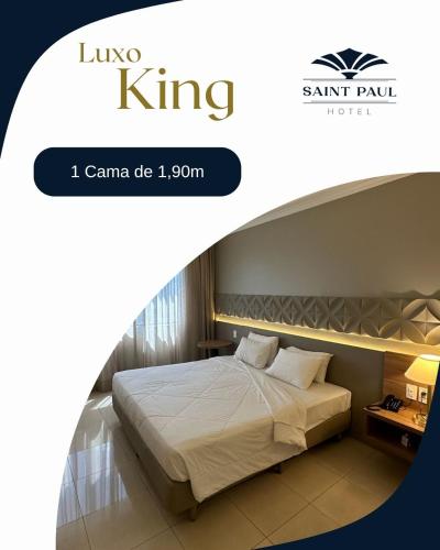 a hotel room with a bed and a sign that says king king at Hotel Saint Paul in Sao Jose do Rio Preto
