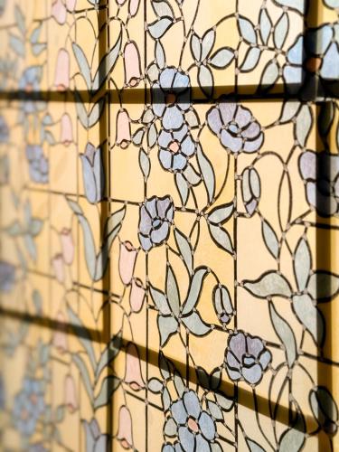 a pattern of flowers on a yellow background at Won stay in Osan