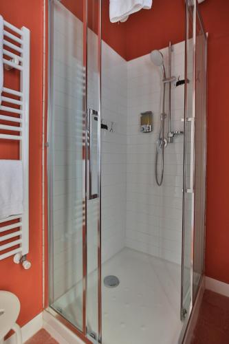 a shower with a glass door in a bathroom at Affittacamere Dai Baracca in Riomaggiore