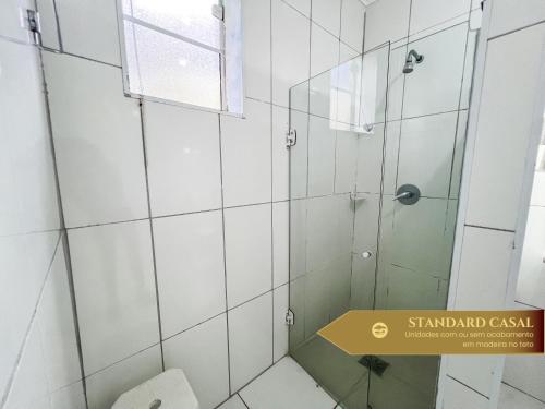 a bathroom with a shower and a toilet at Hotel Fazenda Golden Park Campos do Jordão in Campos do Jordão