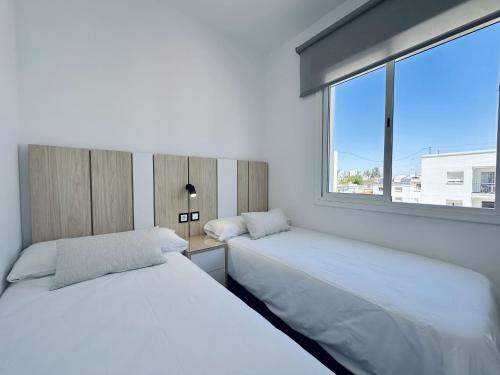 Postel nebo postele na pokoji v ubytování Apartamentos Turísticos Santo Rostro