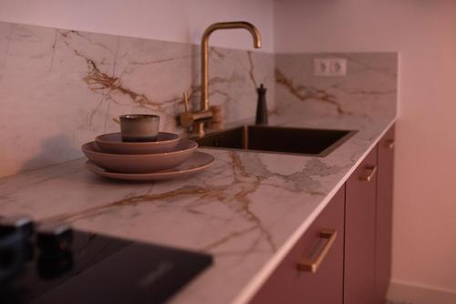 a kitchen counter with a sink and a coffee cup at Villa Bellido in Alora