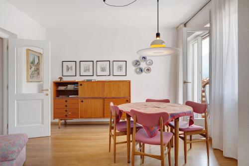 a dining room with a table and chairs at Casa Marta in Cavalese