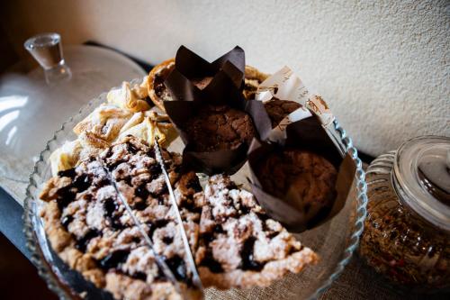 a glass plate with a pie on a table at Dolcevita guest house in Torreano