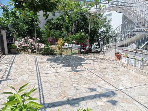 a patio with flowers and plants in a building at Dubrava 112 in Dobra Voda