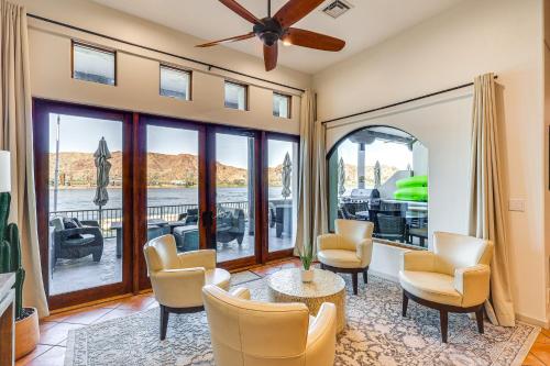 a living room with chairs and a table at Game Room and Dock Riverfront Escape in Parker! in Parker