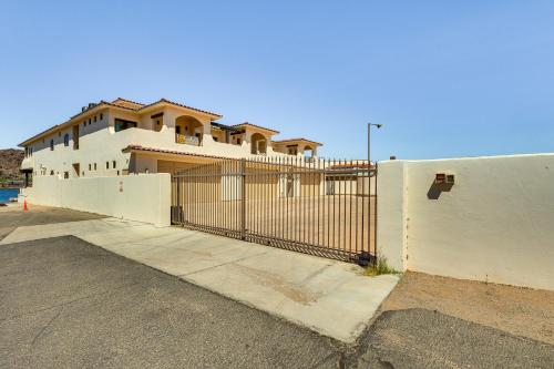 a white fence in front of a house at Game Room and Dock Riverfront Escape in Parker! in Parker