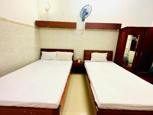 Ένα ή περισσότερα κρεβάτια σε δωμάτιο στο THANH QUANG Guest House