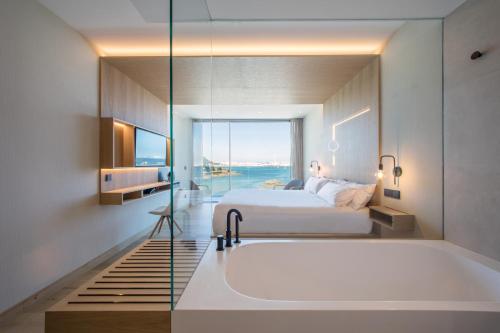 Letto o letti in una camera di Noa Boutique Hotel