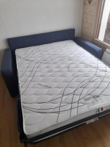 a bed in a room with a mattress at Le cocon du Bettex 1400 - Cozy Apt near Mont Blanc in Saint-Gervais-les-Bains