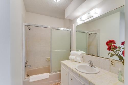 a bathroom with a sink and a large mirror at 2 Mi to Dtwn Spacious Angleton Home with Courtyard! in Angleton