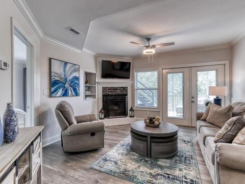 a living room with a couch and a table at Tranquility Skies by Avada Properties in Gatlinburg