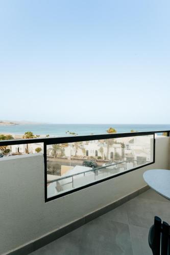 a balcony with a view of the ocean at R2 HIGOS BEACH in Costa Calma