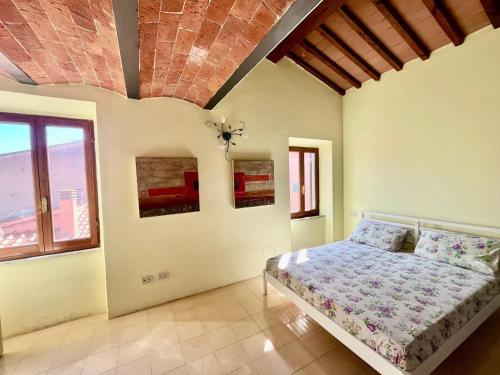 Postel nebo postele na pokoji v ubytování L'Antica Dimora - Elba Affitti