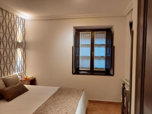 Ένα ή περισσότερα κρεβάτια σε δωμάτιο στο Hotel Rural Entremontes