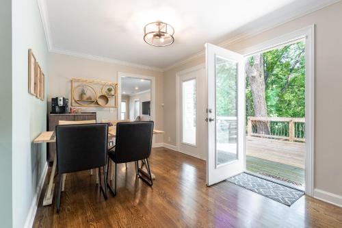 a dining room with a table and chairs at The Eloise by Stay Local Nashville in Nashville