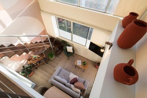 an overhead view of a living room with a couch at Private Terrace Duplex in El Poblado in Medellín