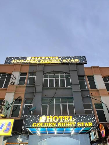 a hotel with a sign on the side of a building at Hotel Golden Night Star in Shah Alam