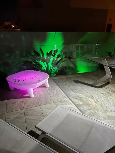 a room with a table and a fishtank at Villa Marjal in Guardamar del Segura