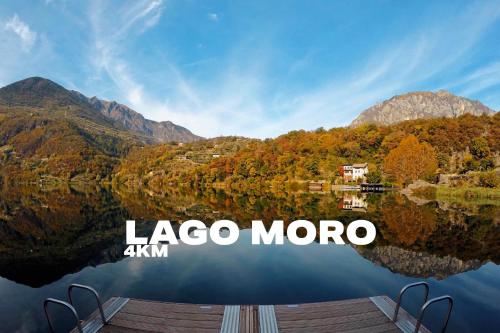 a view of a lake with a mountain in the background at La rocca - private Garden in Darfo