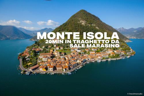 an aerial view of a small island in a body of water at La rocca - private Garden in Darfo