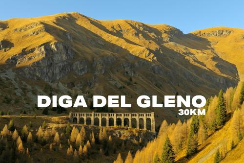 a sign that reads dielta del glencolo with a mountain at La rocca - private Garden in Darfo
