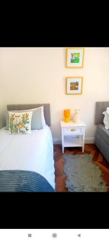 a bedroom with a bed and a table and a couch at The hill view cottage in Doochary