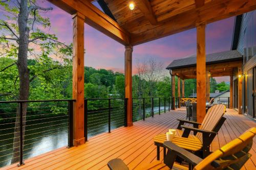 a screened in porch with a view of the water at Enchanting Riverscape in Townsend
