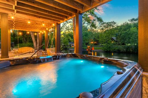 a swimming pool in a house with a river at Enchanting Riverscape in Townsend