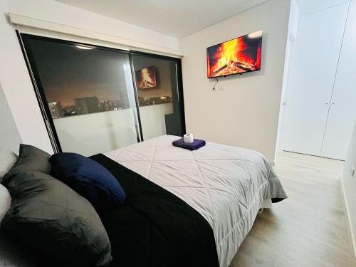 Postel nebo postele na pokoji v ubytování Hermoso y céntrico departamento en Lima con vista a la ciudad