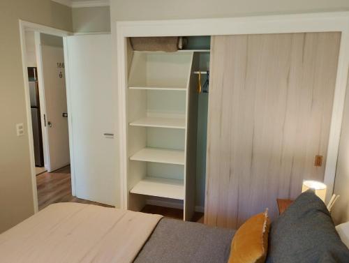 Postel nebo postele na pokoji v ubytování Condominio Nuevo Parque Suizo