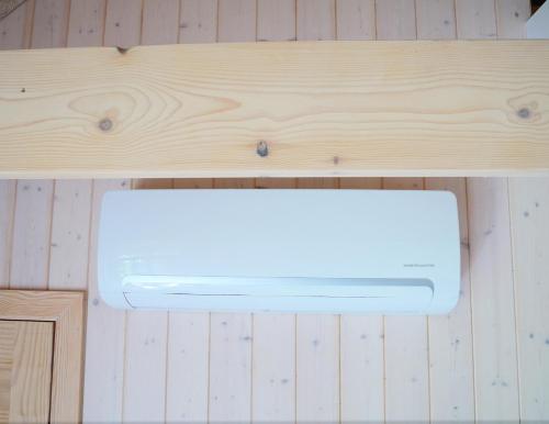 a wooden counter top with a light on it at Vecmartini in Pape