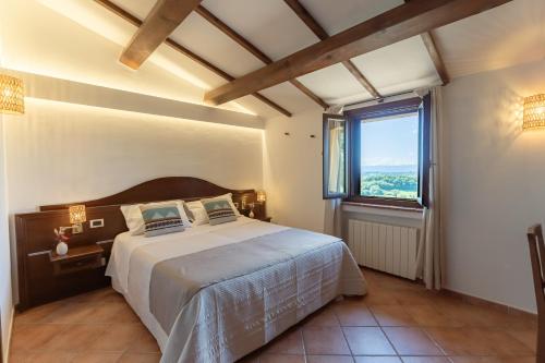 Postel nebo postele na pokoji v ubytování Agriturismo San Felicissimo