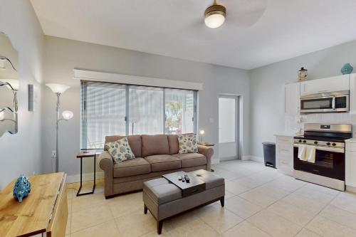 a living room with a couch and a table at 53 Steps to Beach in Clearwater Beach