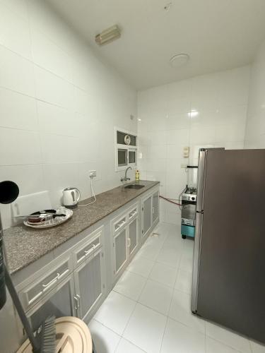 أجنحة هومينج ــ Homing Suitesにあるキッチンまたは簡易キッチン