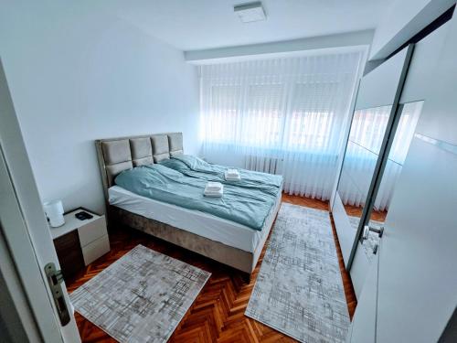 Ένα ή περισσότερα κρεβάτια σε δωμάτιο στο Turquoise Sunny Apartment