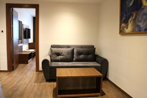 a living room with a couch and a coffee table at El Aziz Inn in Cheraga