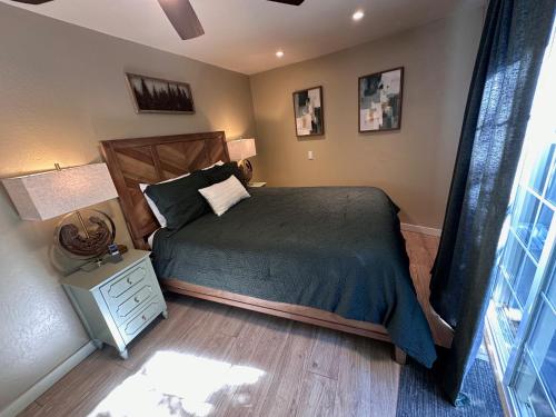 a bedroom with a bed with a wooden head board at Either Way Hideaway in Boulder Creek