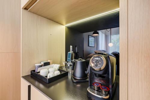 a kitchen with a coffee maker on a counter at The March Hotel in Miami Beach