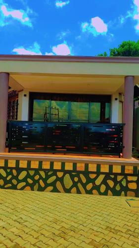 a building with a large window on top of it at Chalet suits in Kampala