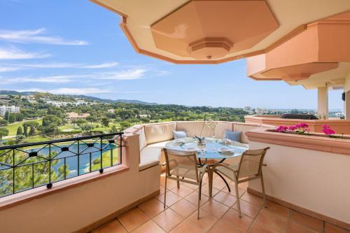a balcony with a table and chairs and a view at Río Real Vista Golf, by Homing U in Marbella