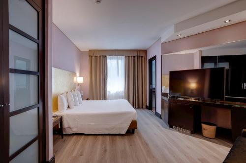 Postel nebo postele na pokoji v ubytování Hotel Nord