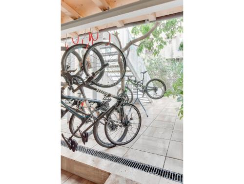 a group of bikes are hanging on a wall at Hotel Medusa in Finale Ligure
