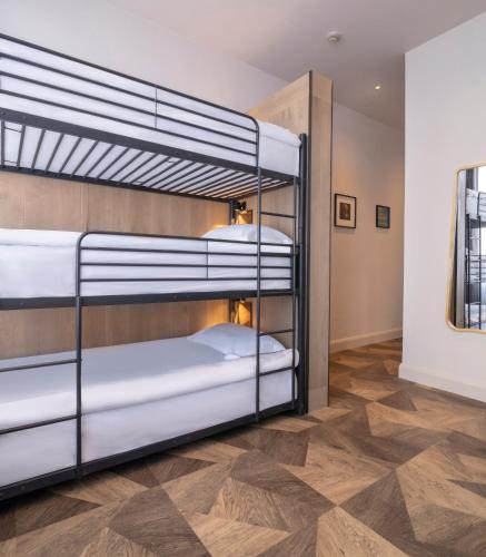 a room with two bunk beds in a room at Limerick City Hotel in Limerick