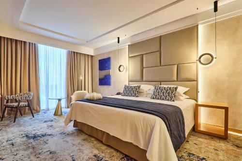 Postel nebo postele na pokoji v ubytování Hotel de Convenções de Talatona, HCTA